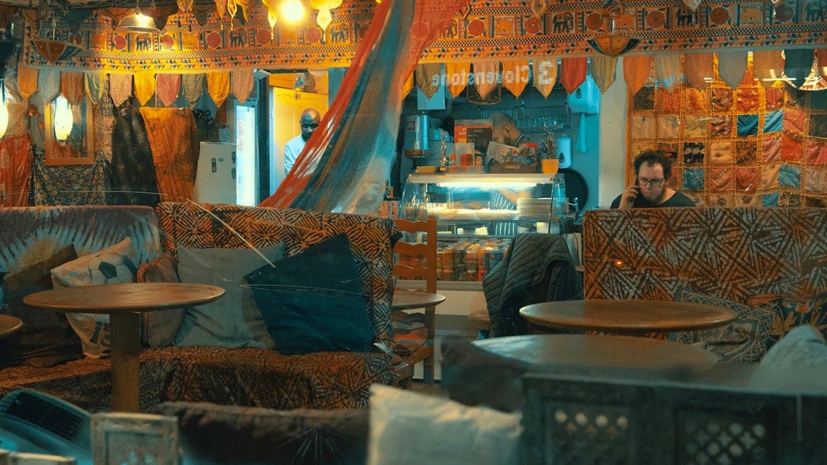 Cushions and low benches under hanging fabrics