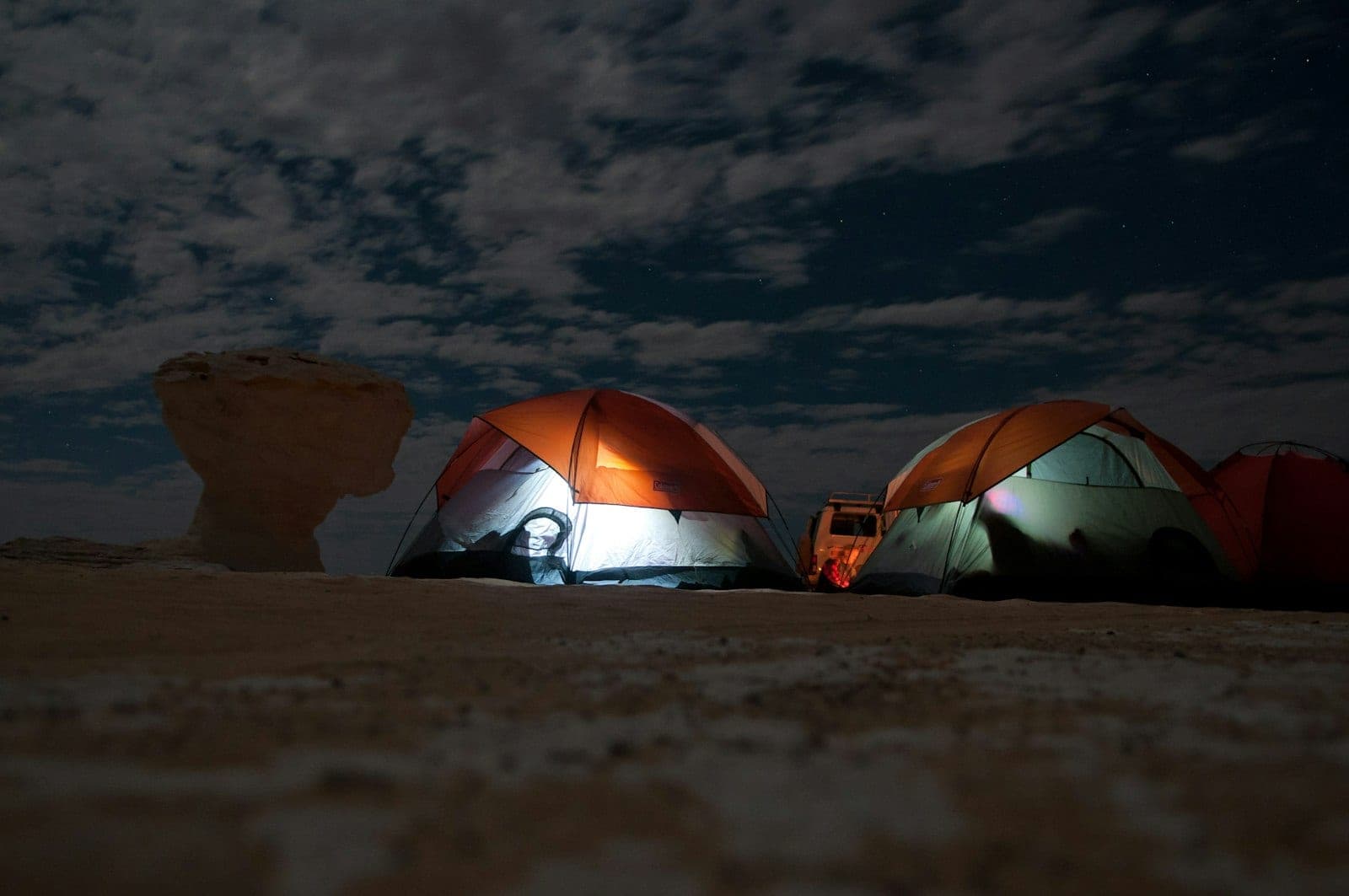 The tents lit from within, once the sun has gone.