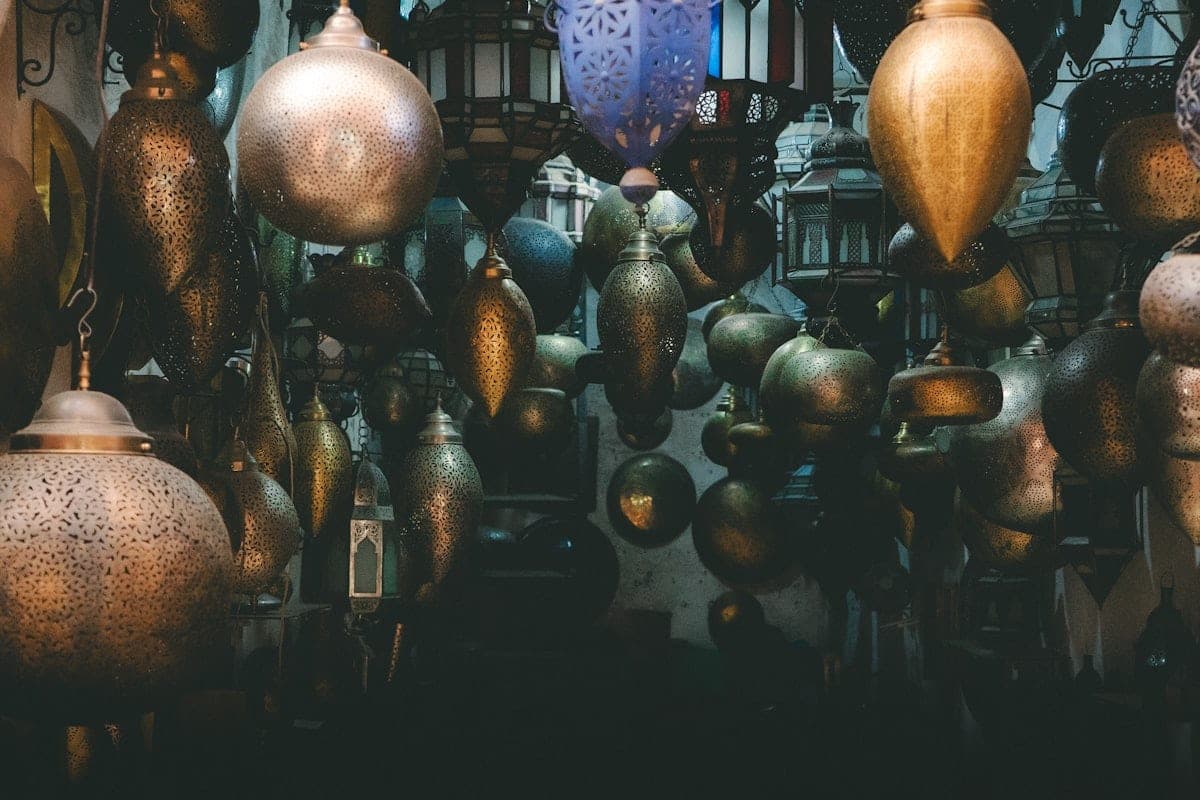 Brass lanterns hanging in the half-light