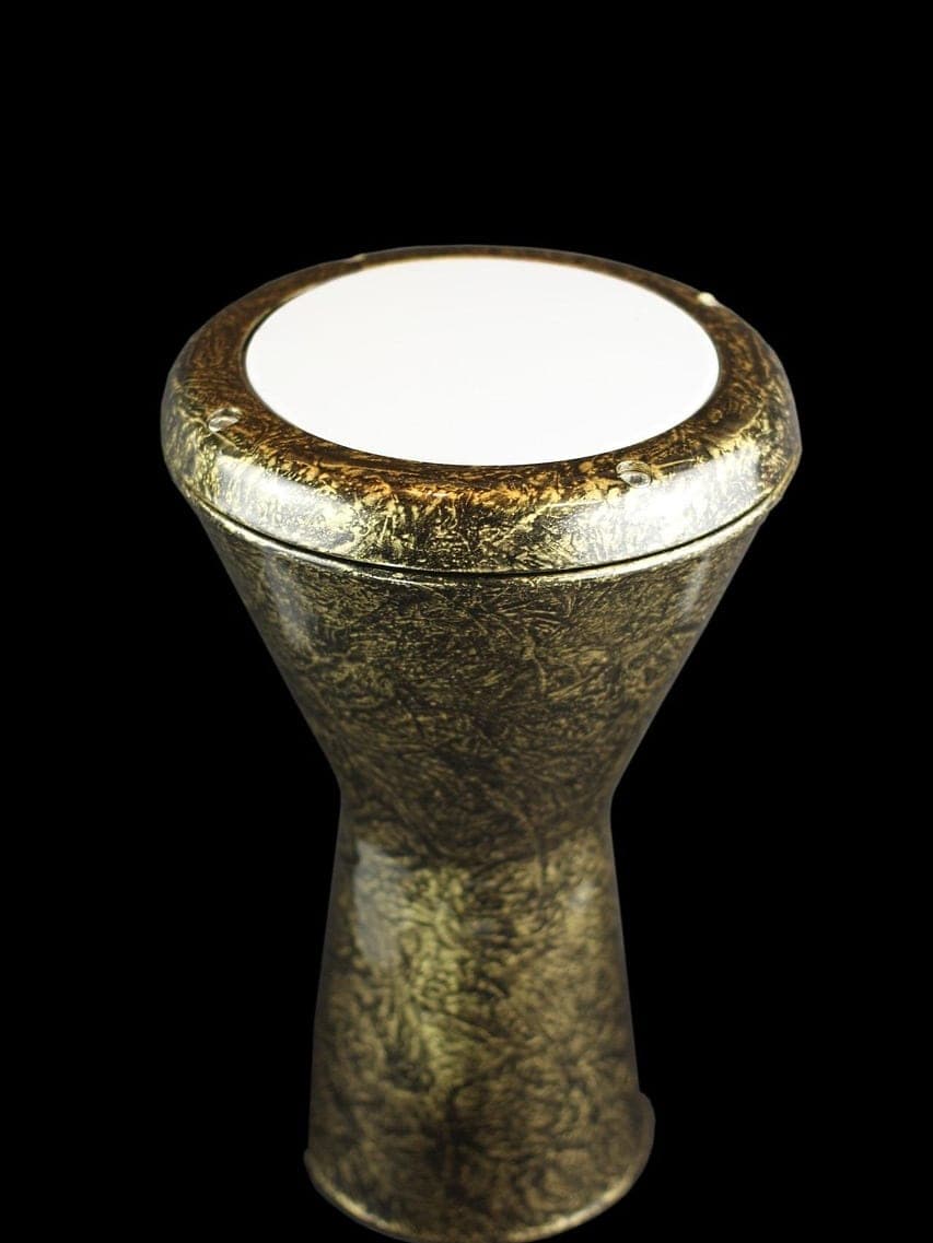 A brass darbuka drum alone against a black background.