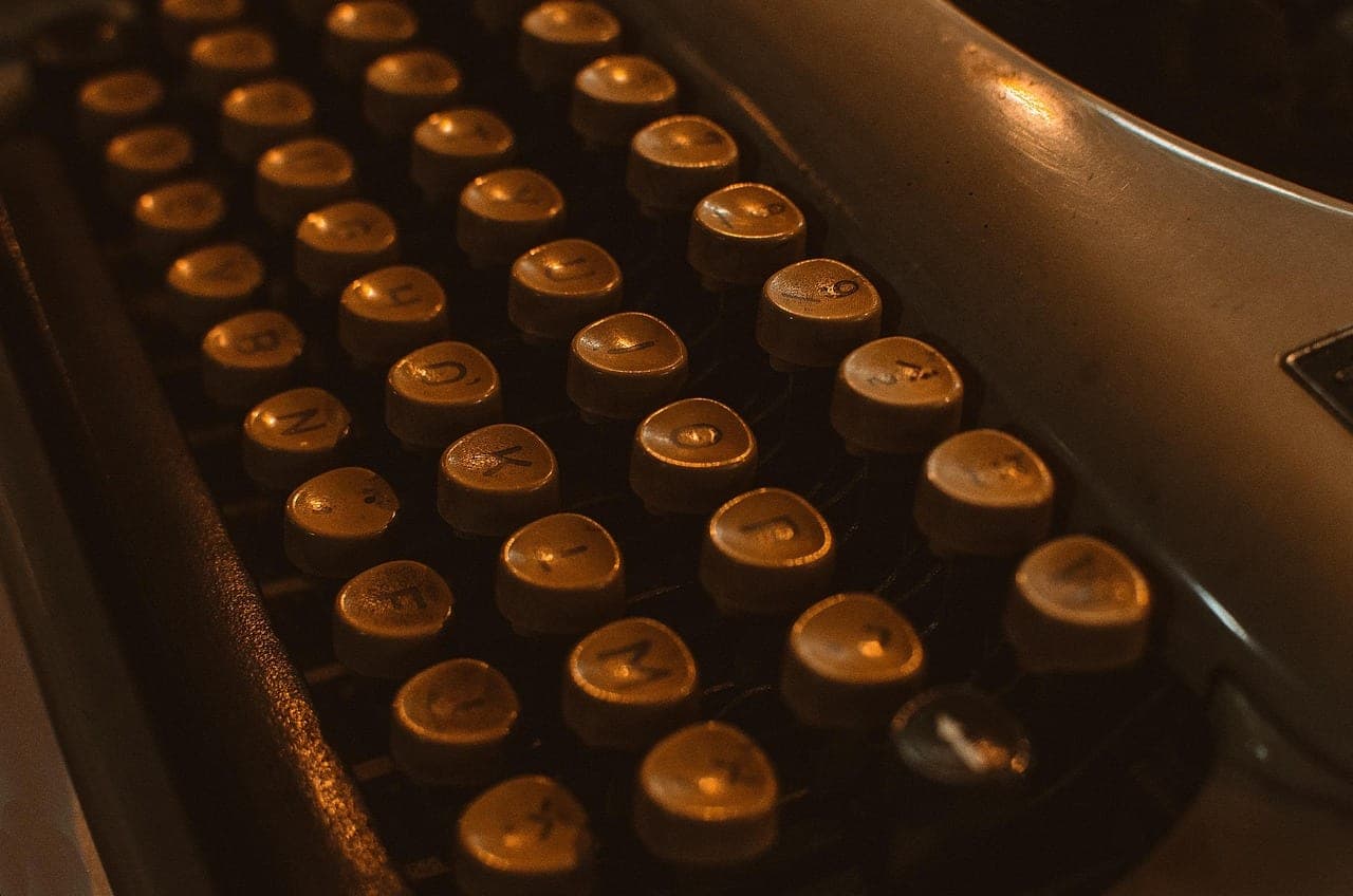 The round keys of an old typewriter, lit in close-up.