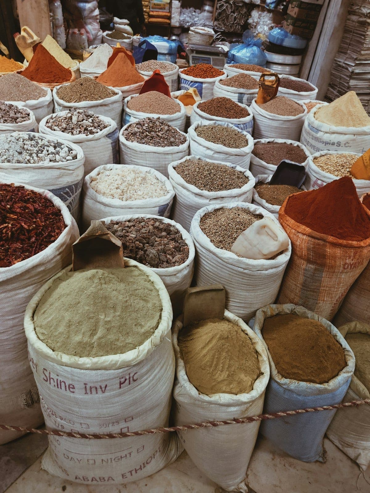 Open sacks of spices and grains on the stall