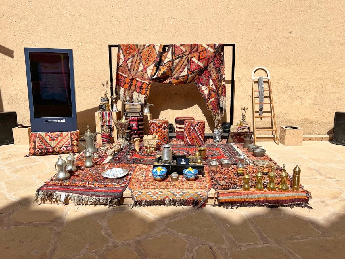 Rugs on the ground, copper coffee pots and small cups