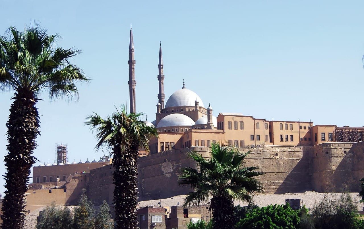 The walls from below — a fortress before it is a mosque.