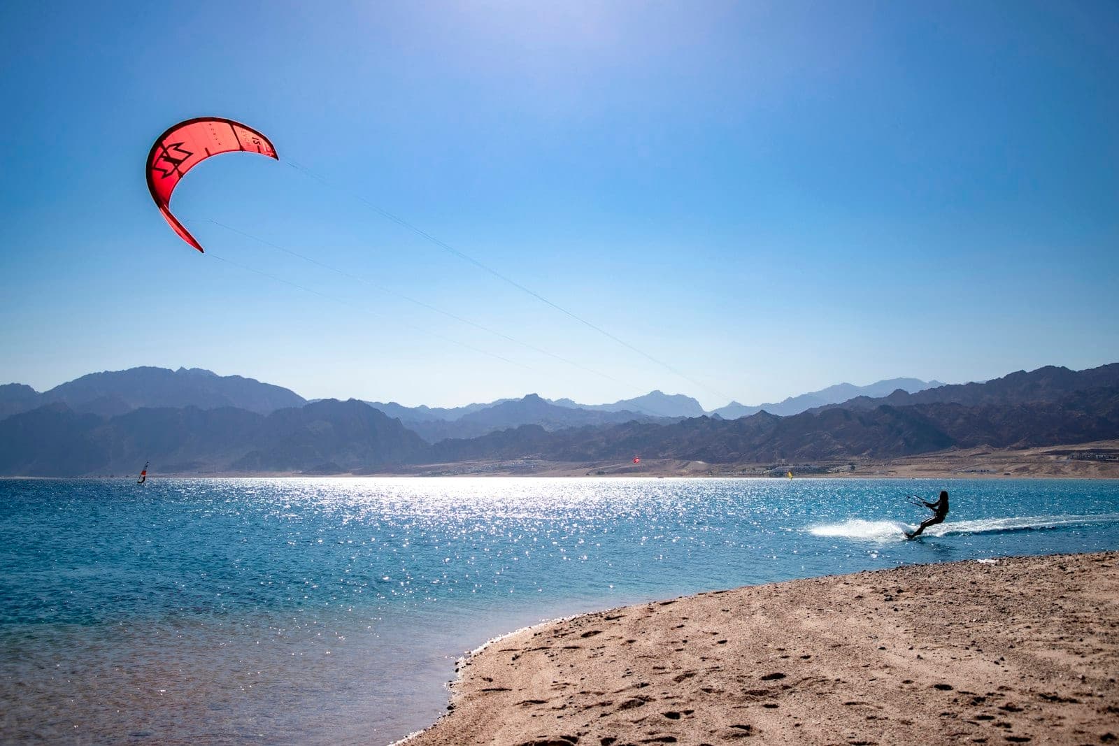 The lagoon stays shallow far out — you learn standing up.