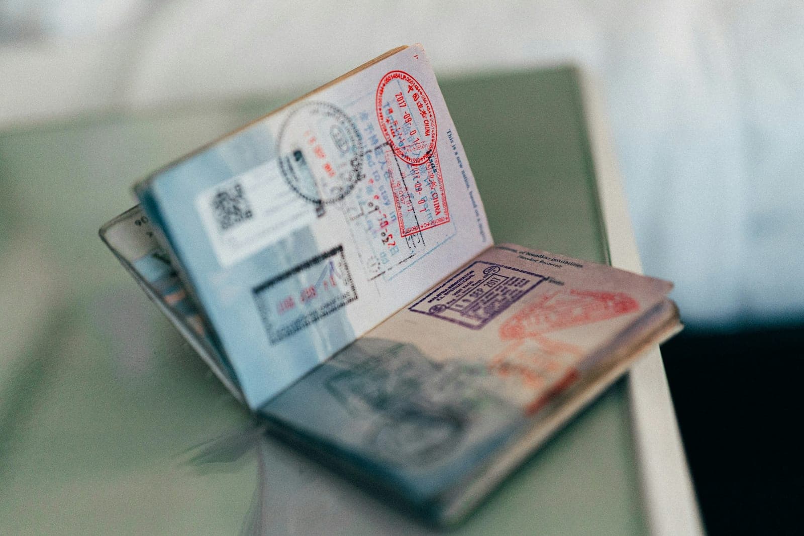 A passport open at its entry stamps.